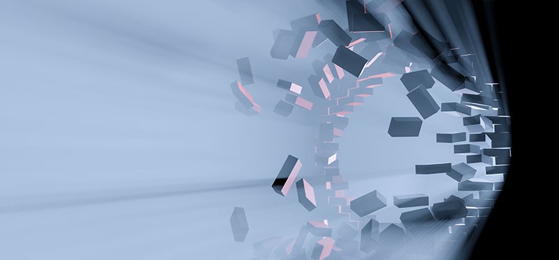 Brick wall being broken apart