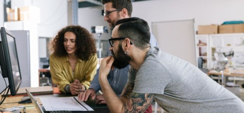 3 colleagues working on something