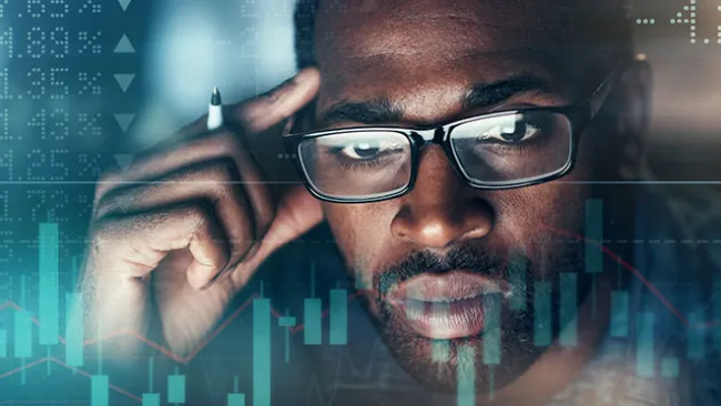 Man looking through a computer screen