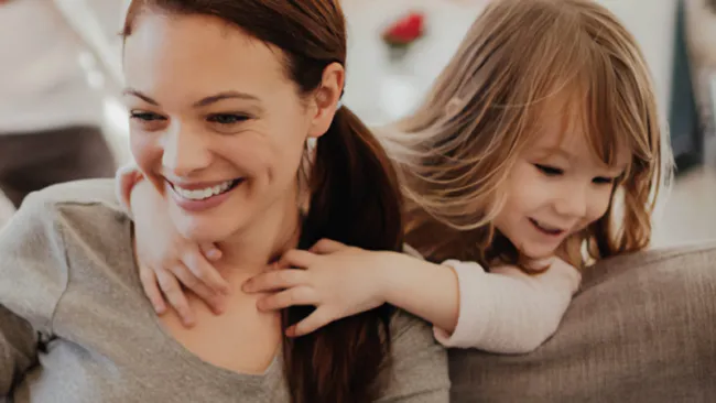 Mother and daughter on a couch