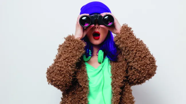 Person looking through binoculars