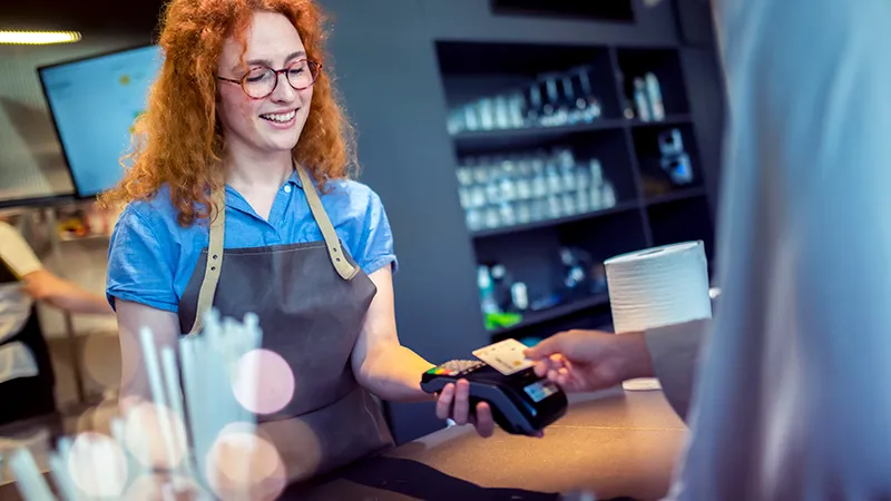 A cashier accepting card payment