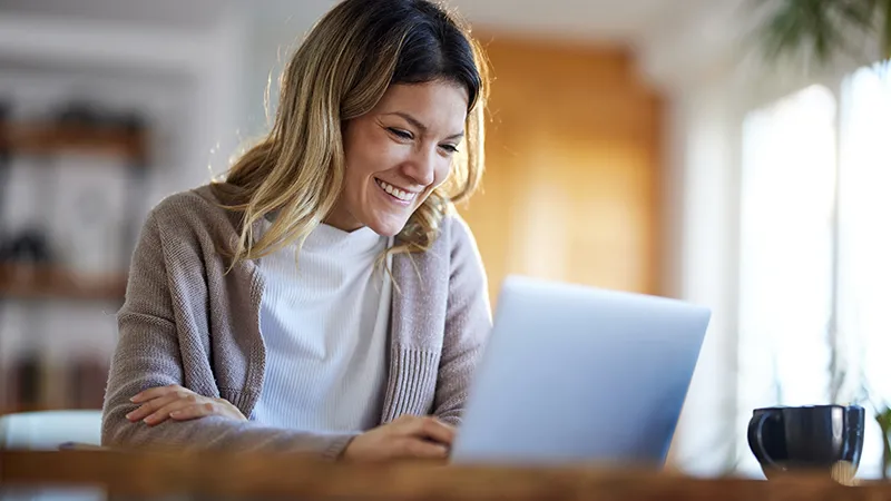 A woman virtually talking to someone via laptop