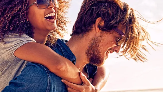 Man and woman walking on beach