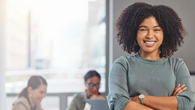 Woman in meeting room smiling at camera