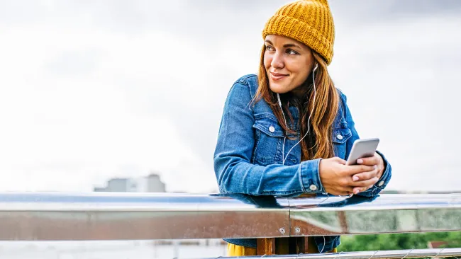 Woman standing on bridge over water