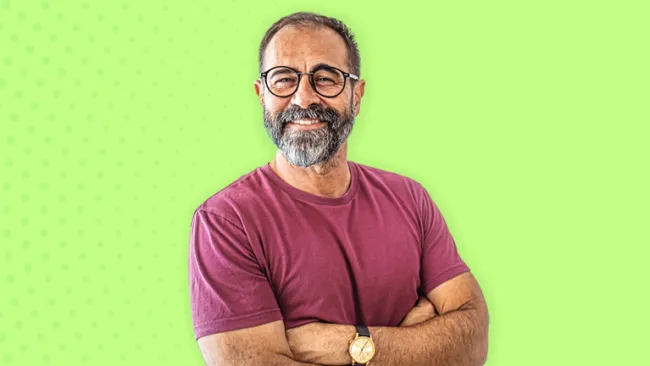 Man in a red shirt smiling