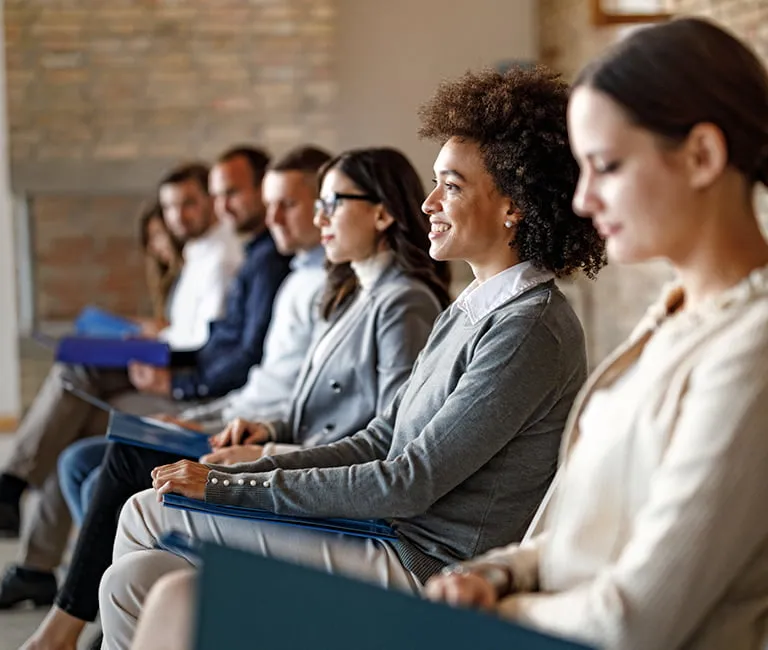 Group of people sitting in a waiting room