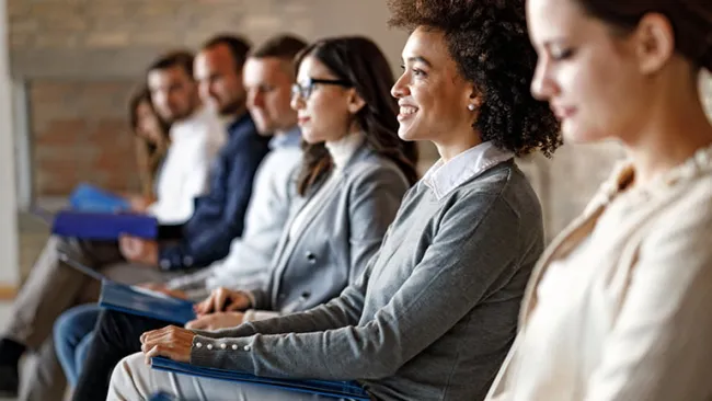 Group of people sitting in a waiting room