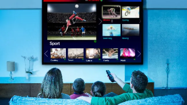 A family watching TV in the living room