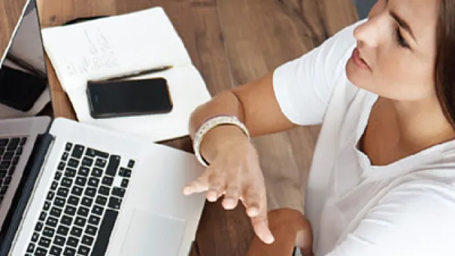 Man and woman having a conversation at a conference table