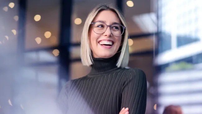 Employee smiling in a conference room