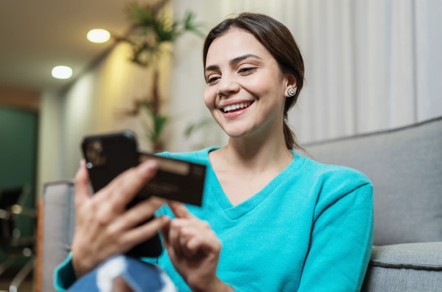 Woman entering her credit card on her phone
