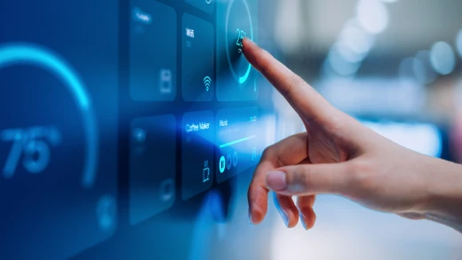 A person touching a touchscreen monitor