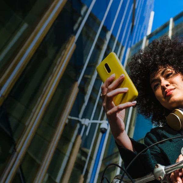 Woman using her phone in a city