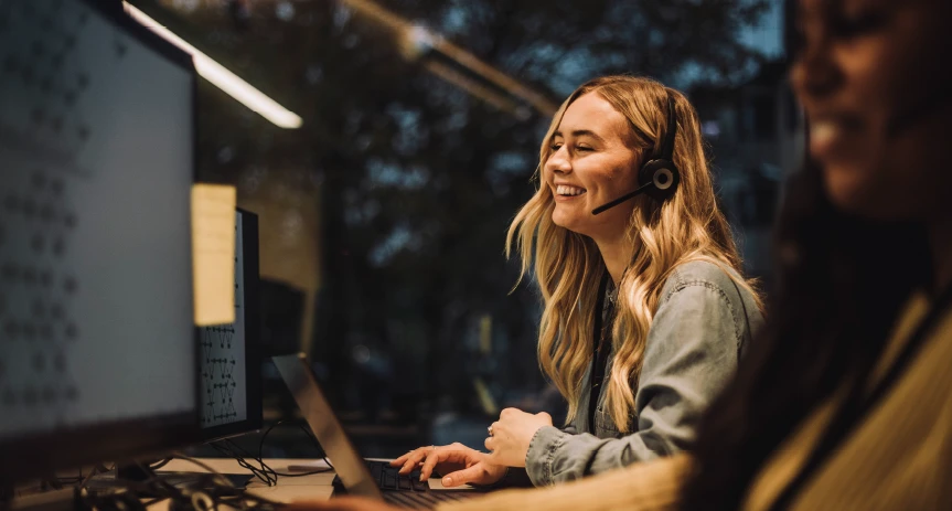 An associate answering a call at their desk