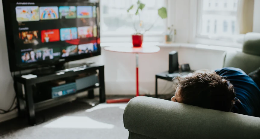 Relaxing on a couch watching the television