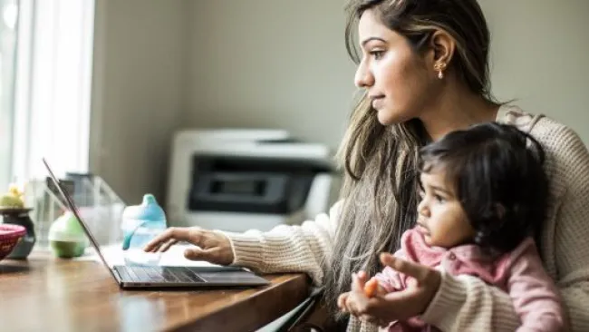 A mom working from home with her baby